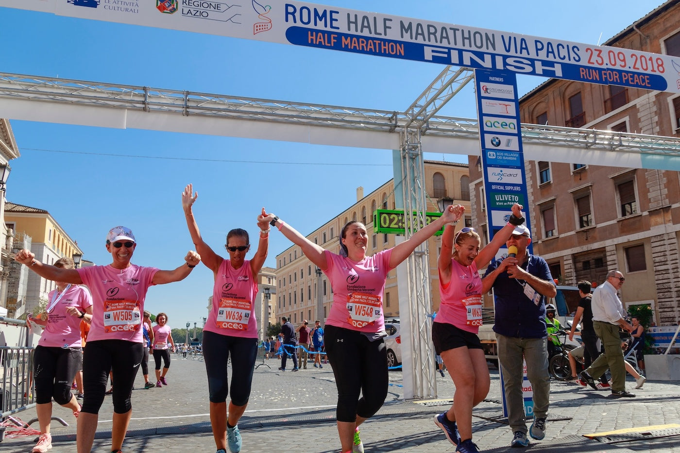 Four women running for charity with temporary tattoos